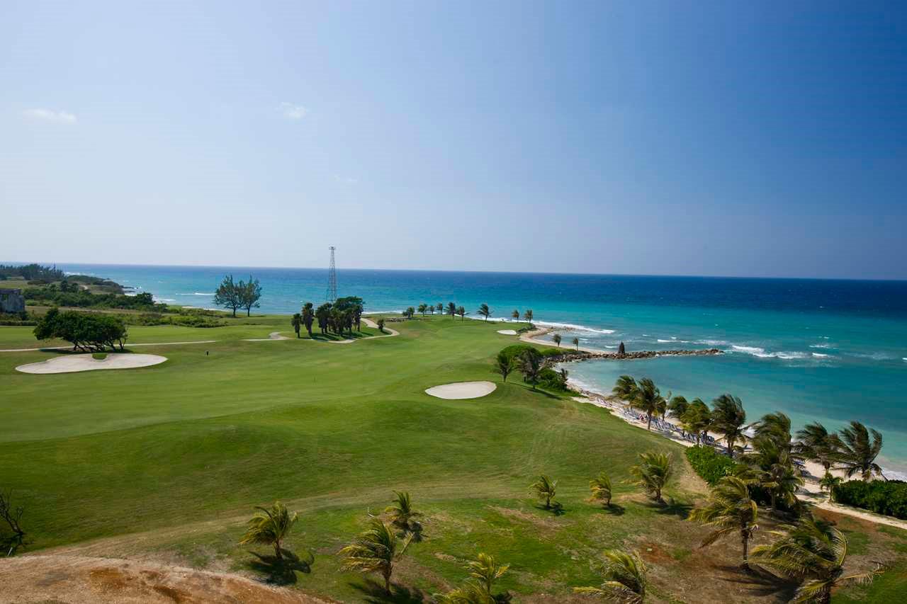 A well maintained coastal fairway nestled wit sand bunkers