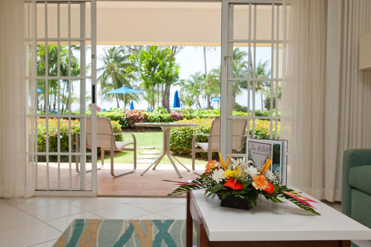 Living room and patio space as part of a suite at Turtle Beach by Elegant Hotels
