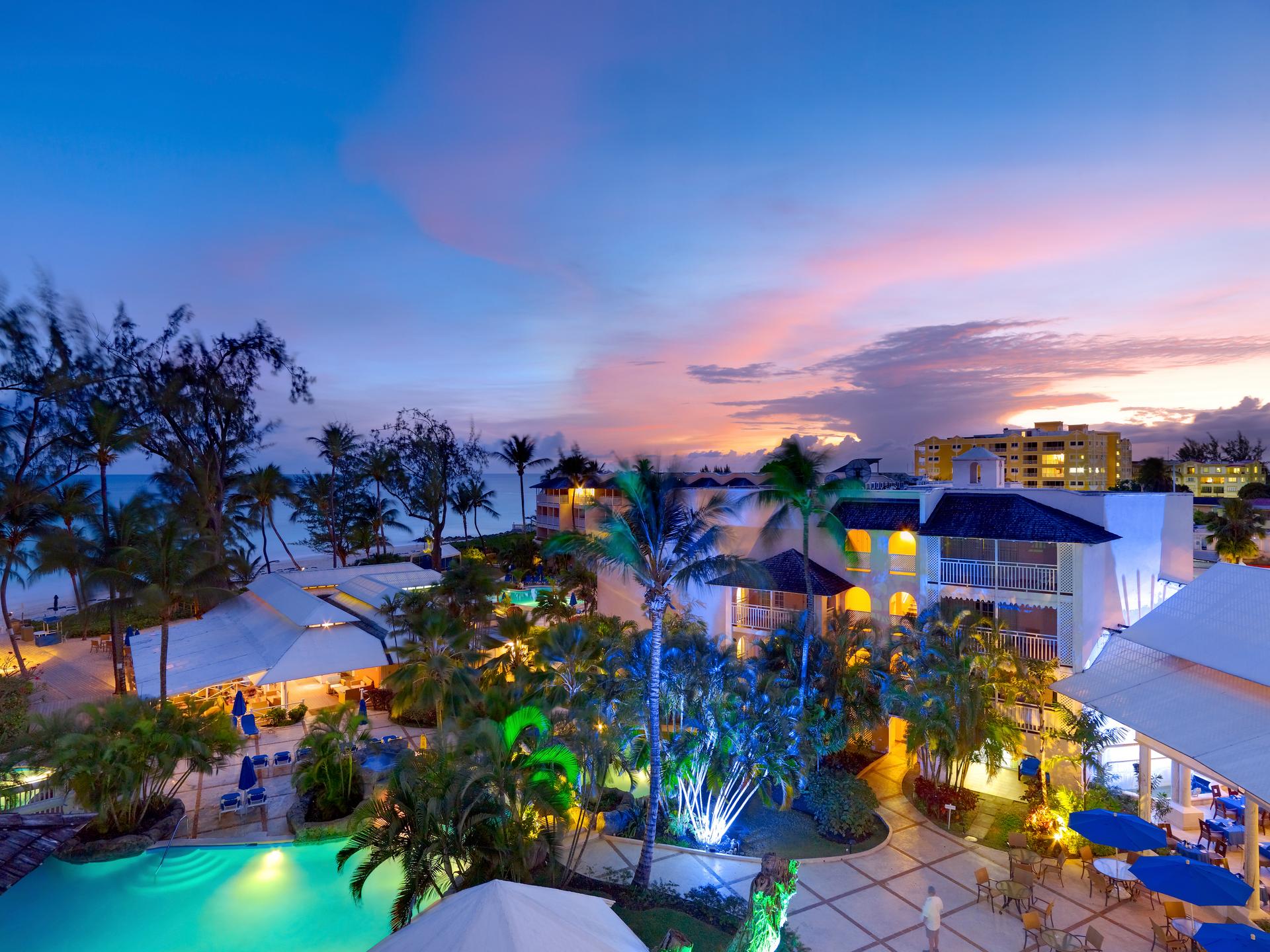 Overhead view of Turtle Beach by Elegant Hotels lit up at night time