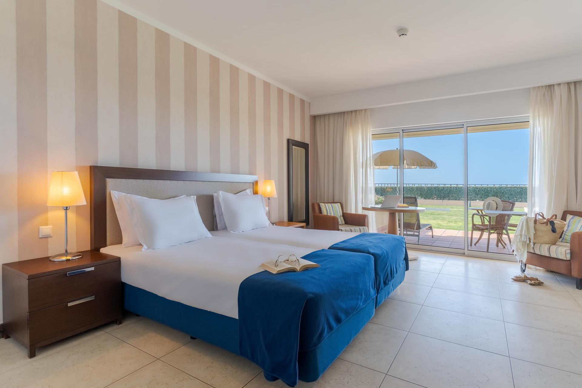 Twin bed room with coastal views at part of a villa at Pestana Alvor Beach Villas