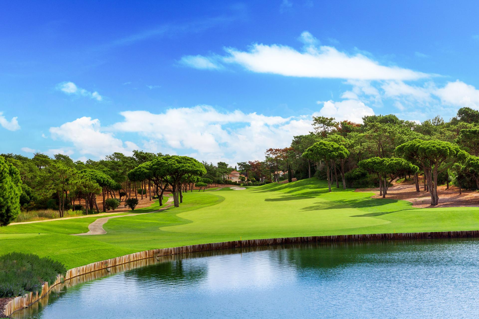 Well maintained fairway leading to a water hazard