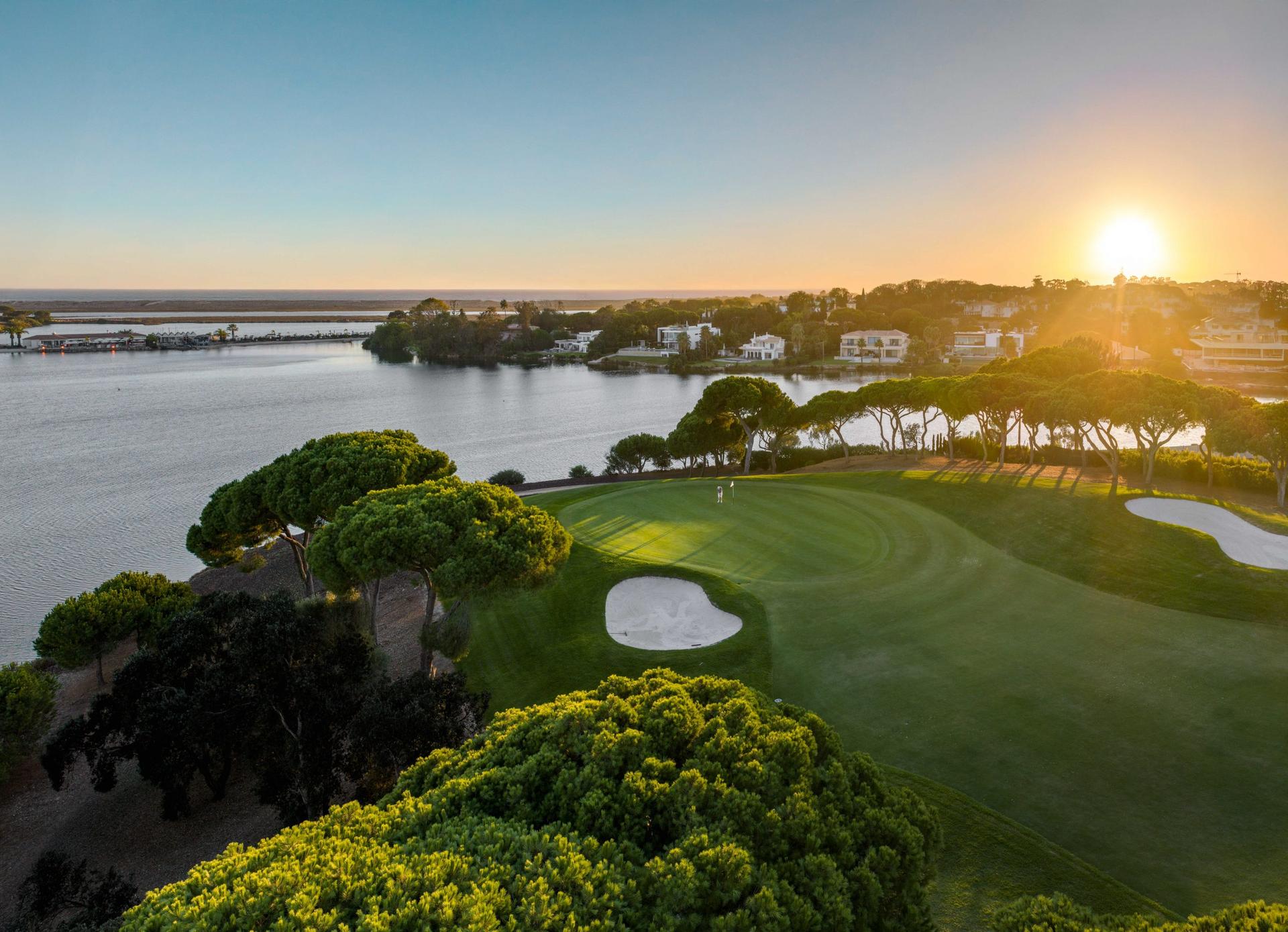 Sun setting over a coastal green